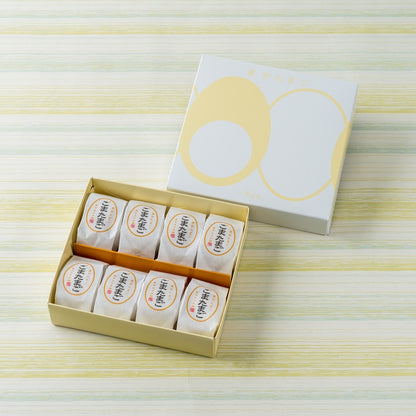Open Goma Tamago box with eight individually wrapped egg cakes