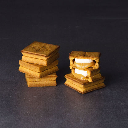 PRESS BUTTER SAND cookies close-up showing butter cream and caramel layers